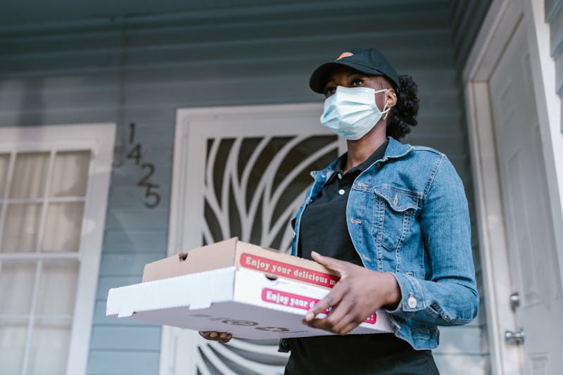 Pizza delivery arriving at home